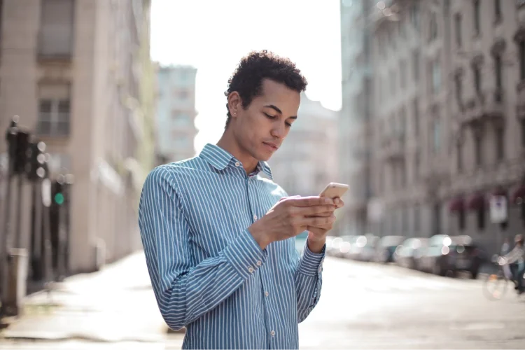 Man typing on mobile
