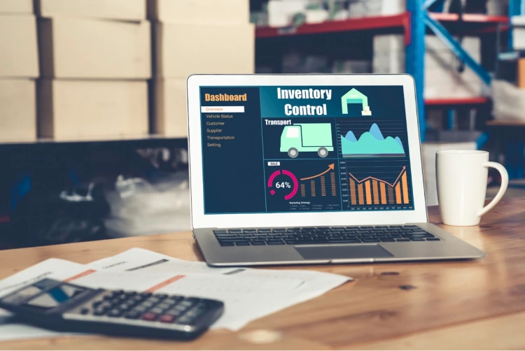 Computer on table showing inventory control data