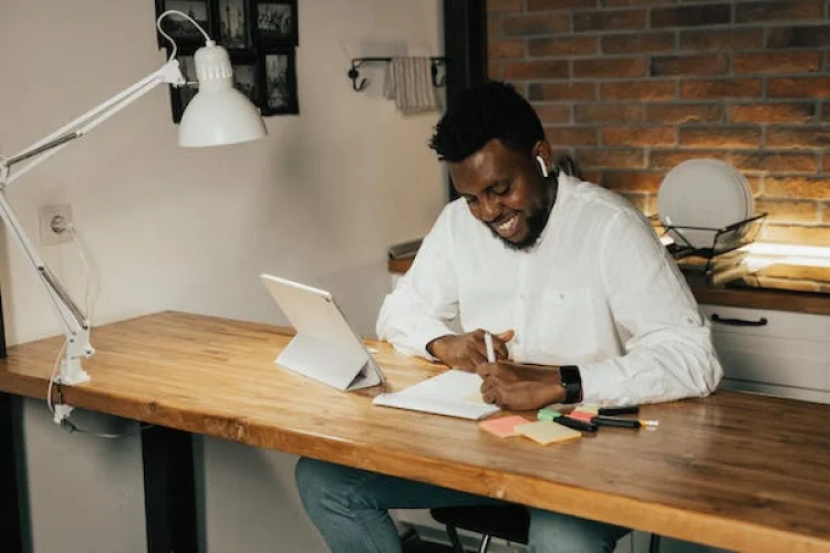 Person working on PPC optimization at a desk