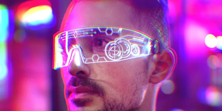 Future man wearing space-age glasses with computer interface in lenses