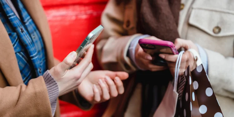 Women hold mobile