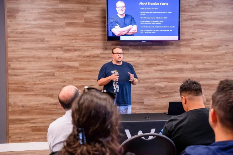 Person leading a discussion at an event.