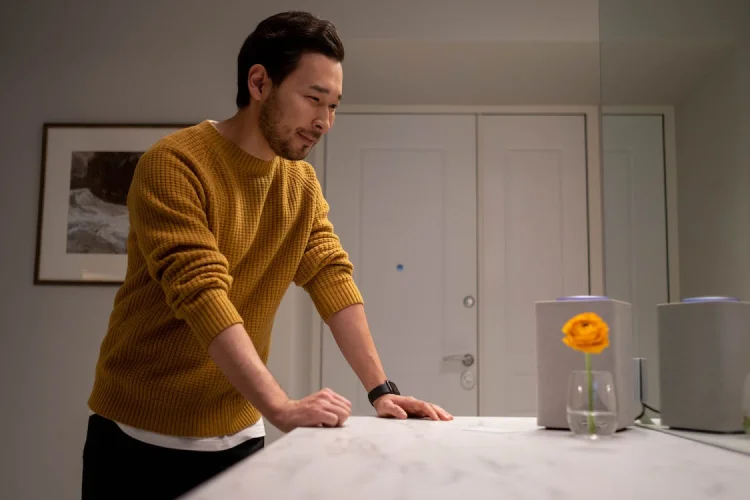 Person using smart speaker